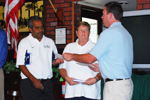 SBART President-Elect Rich Hanna hands San Marcos Athletic Director Abe Jahadmy a check for the school's athletic program. The money was raised by the Round Table at last spring's Hi-Five Tennis Tournament.