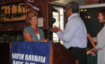 Debra Koopmans receives applause from San Marcos Athletic Director Abe Jahadhmy and the crowd.